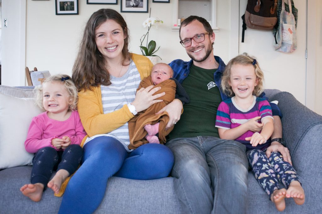 Family of five with newborn baby during smooth postpartum recovery
