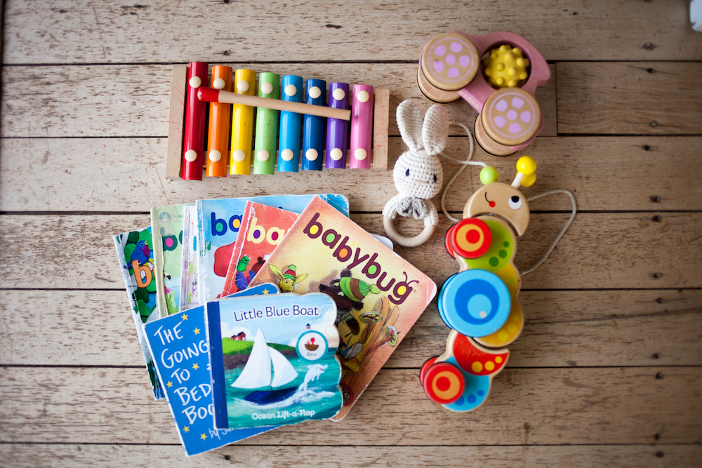 Wooden toys and board books and baby magazine ideas for baby shower gifts