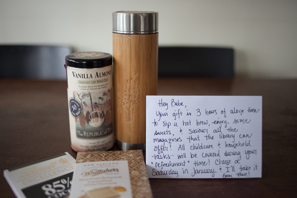 minimalist gift bundle for a mom: tea, tea thermos, chocolate, and a note