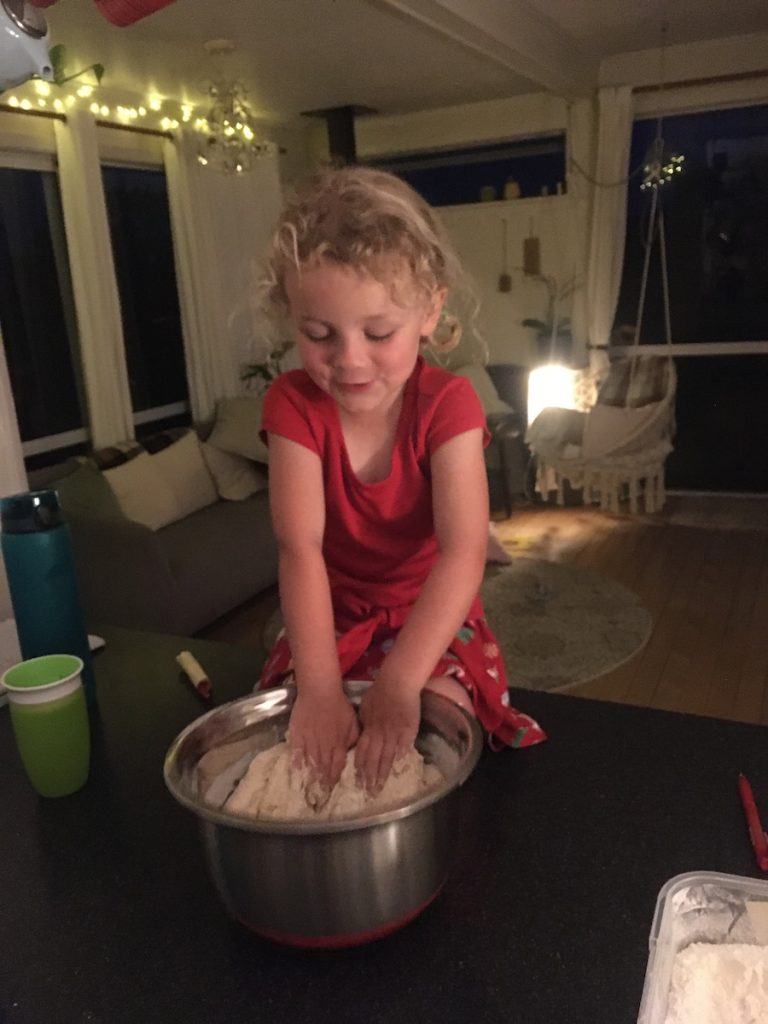 Girl mixing bread dough