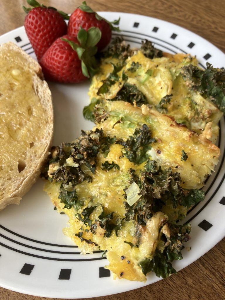 delicious cheesy sheet pan eggs plated for breakfast