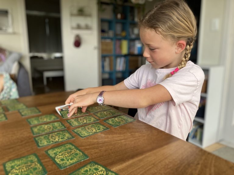 Girl Playing Card Game