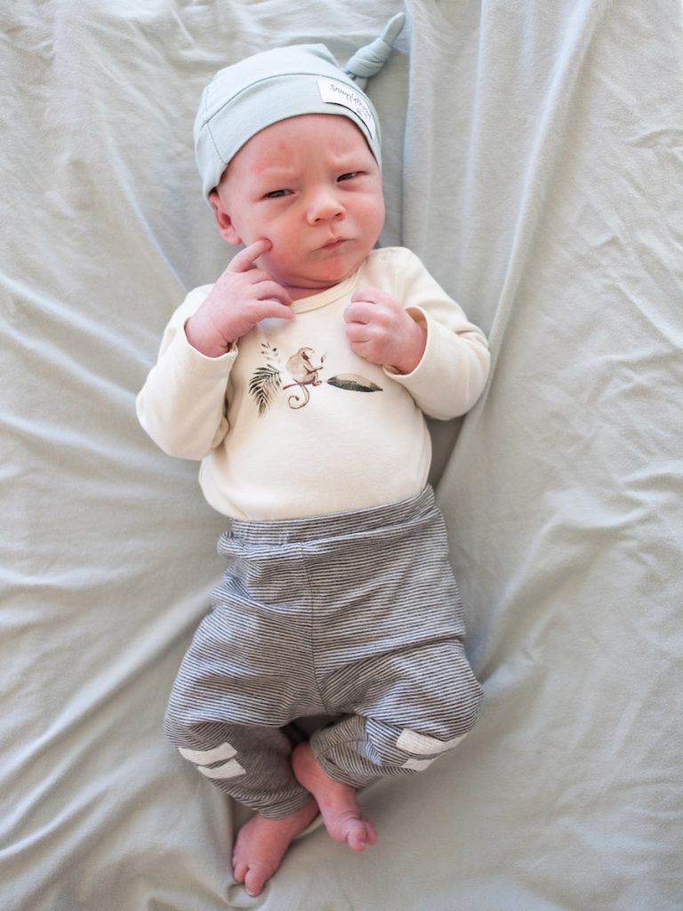 breastfed newborn looking at camera