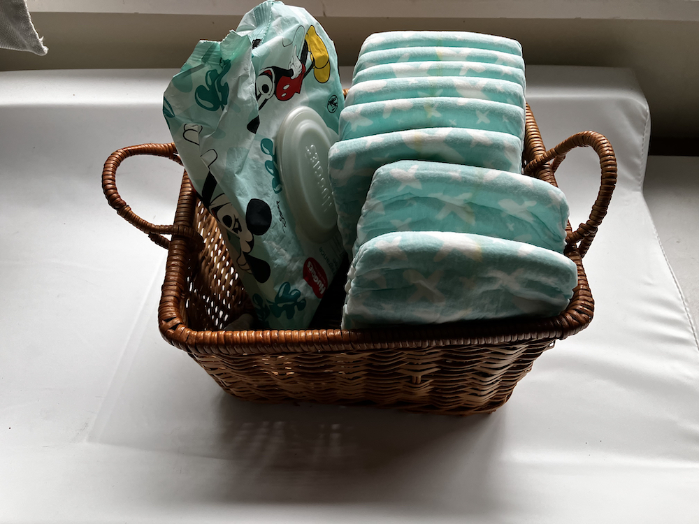 diapers and wipes in a change caddy basket