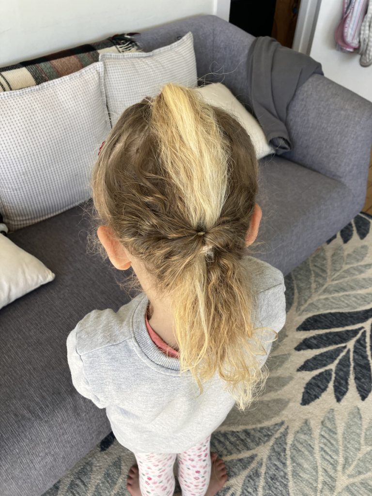 little girl with hair styled ready for the day