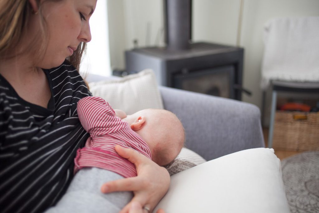 Mom breastfeeding baby first three months