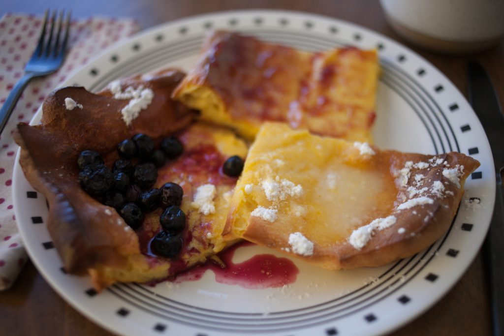 Sheet Pan Swedish Pancake Slices with Toppings on Plate