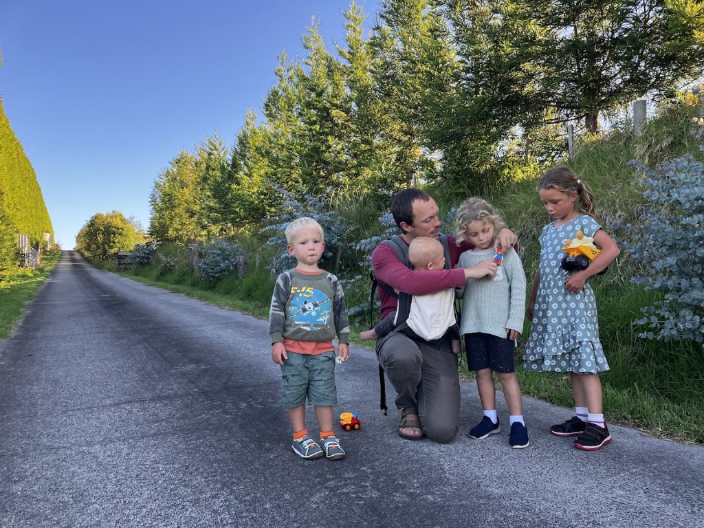 dad with kids outside on family evening walk