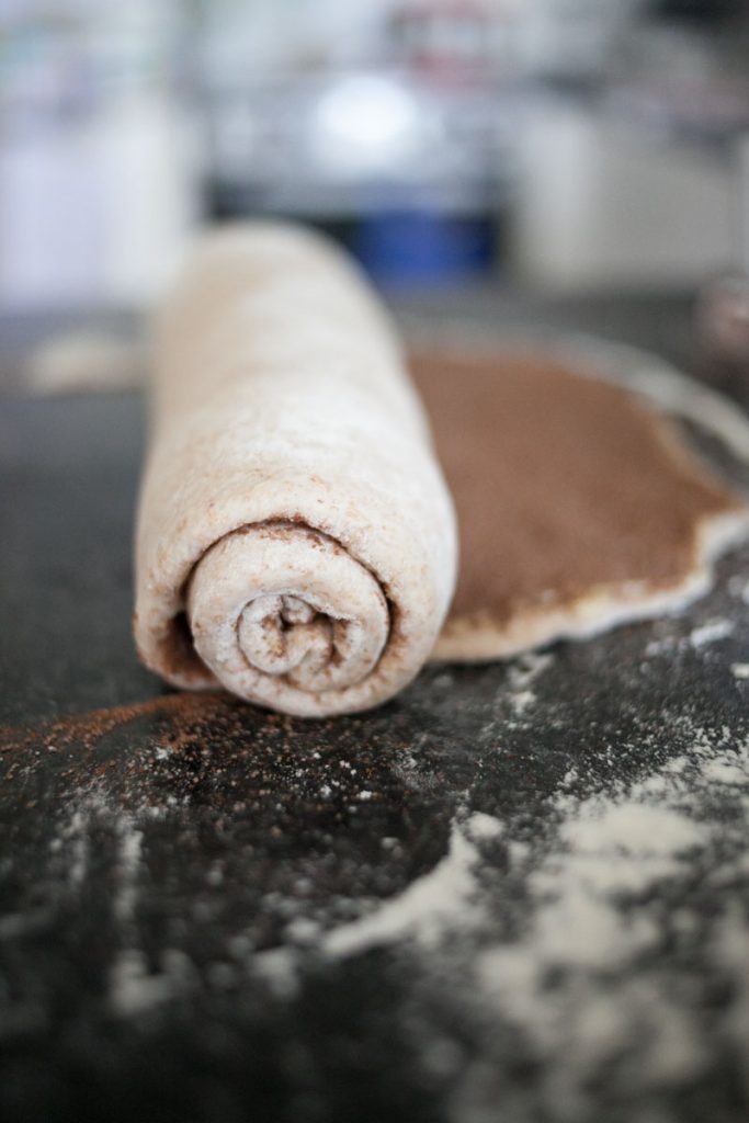 chocolate chai swirl bread dough rolled up on counter top