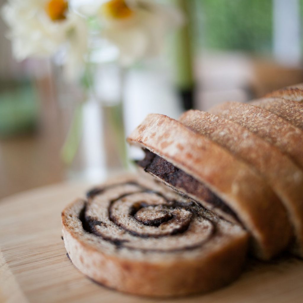 slices of sourdough chocolate chai swirl bread on cutting board