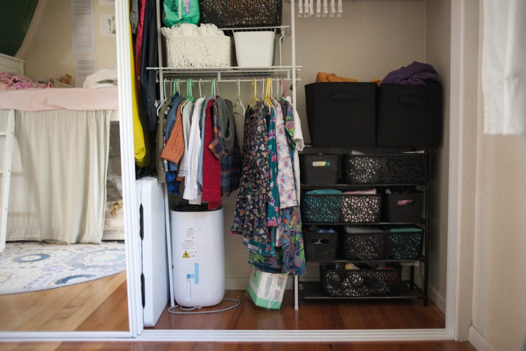 kids closet ideas including a shoe rack with baskets and a low hanging clothes rod for clothes