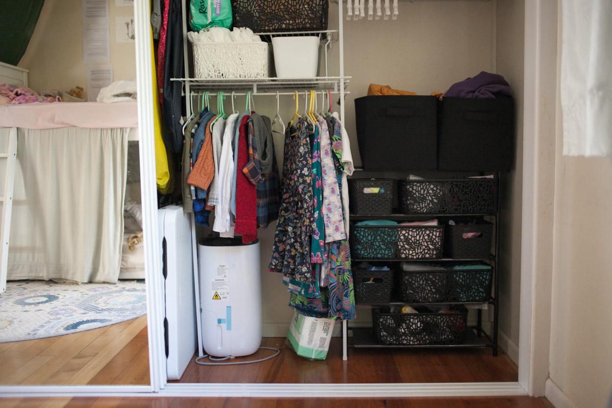 kids closet ideas including a shoe rack with baskets and a low hanging clothes rod for clothes